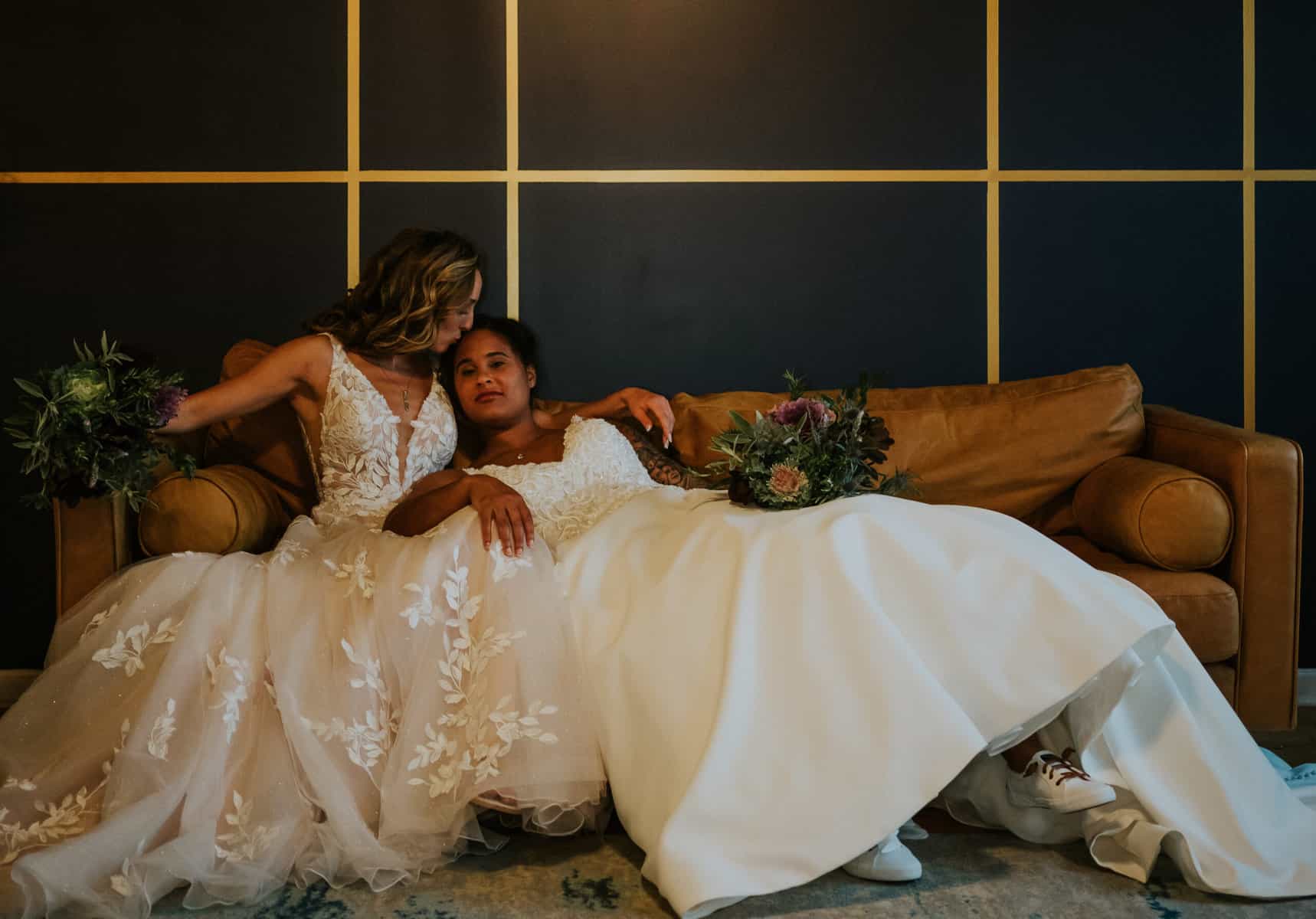 wedding-group-of-stylish-friends-newlyweds-festival-outfits-hugging-each-other-smiling-posing-camera-during-wedding-header