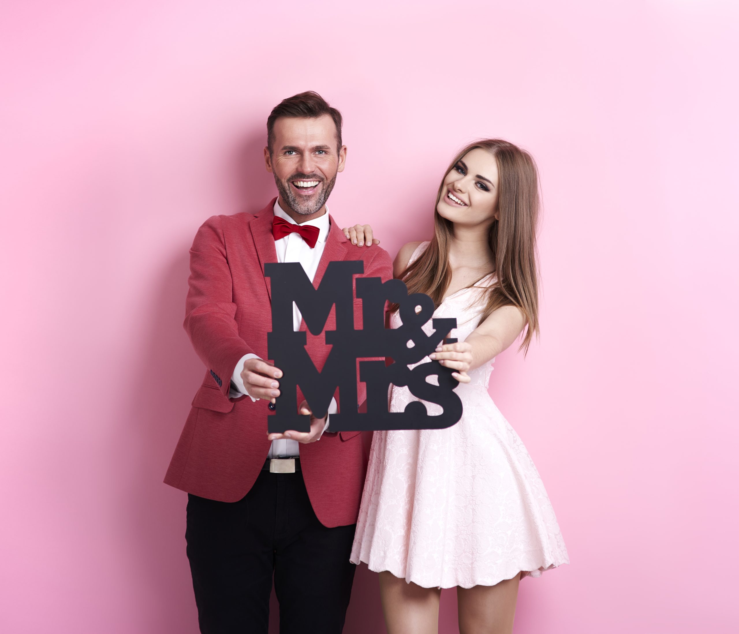 Young marriage posing in studio shot